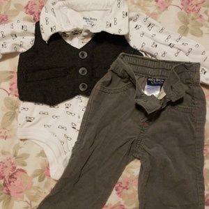 White onesie with black vest and gray pants